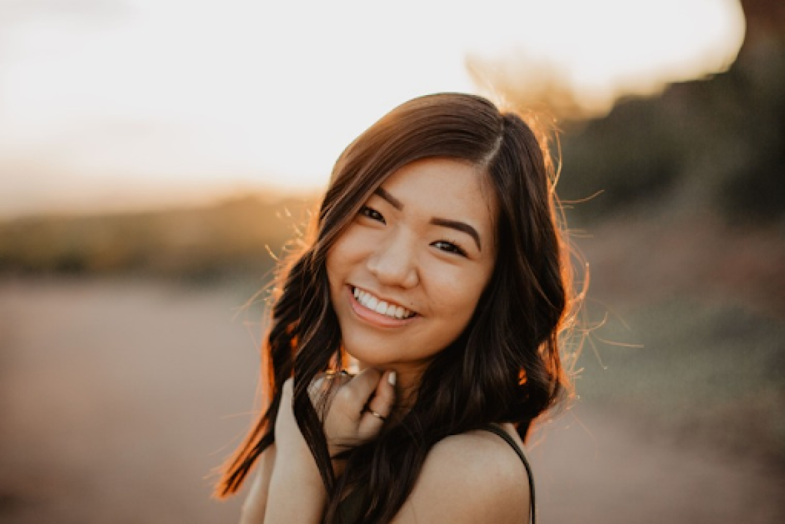 Jodie Tam, an Asian American woman smiling