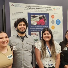 Group of young adults standing in front of an academic poster