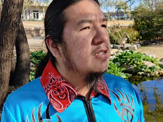 A native man in blue shirt