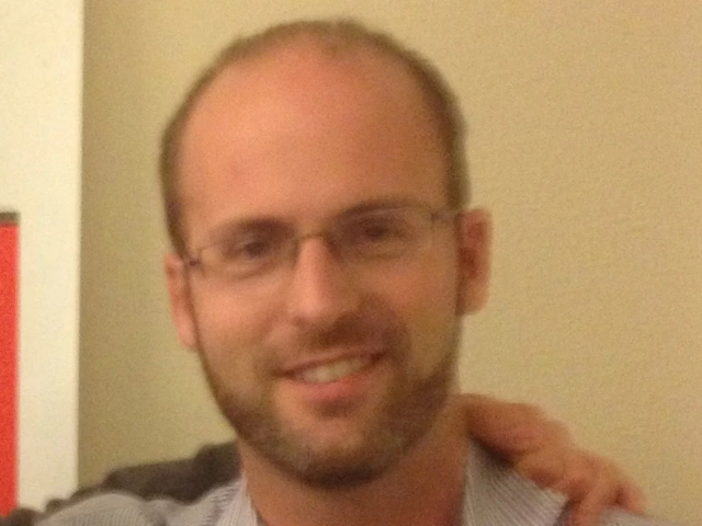 Man in glasses smiling