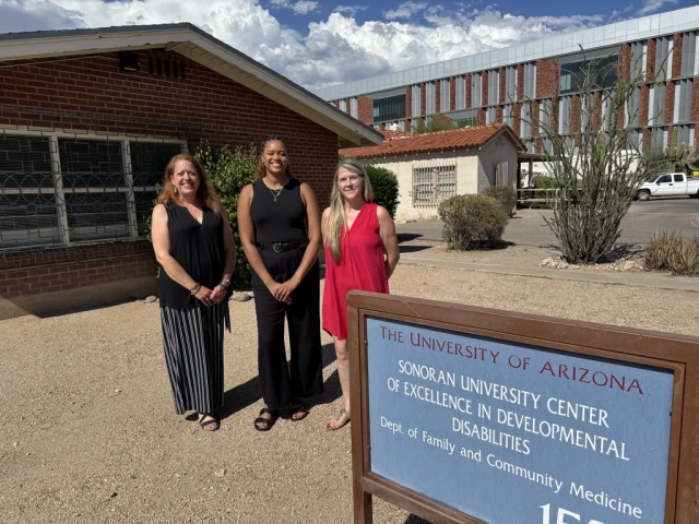 Members of the Employment First team and Sydney Pearson in front of the Sonoran Center office