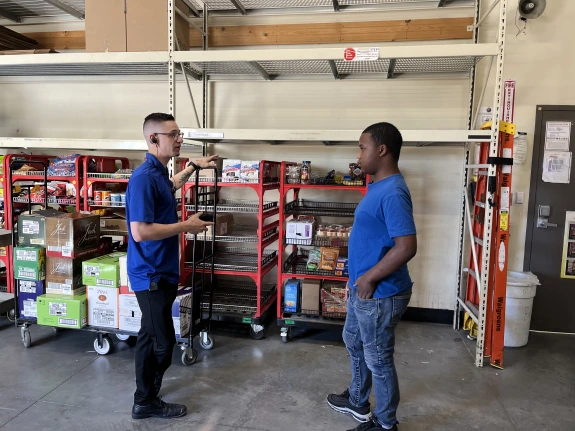 two people working in a warehouse
