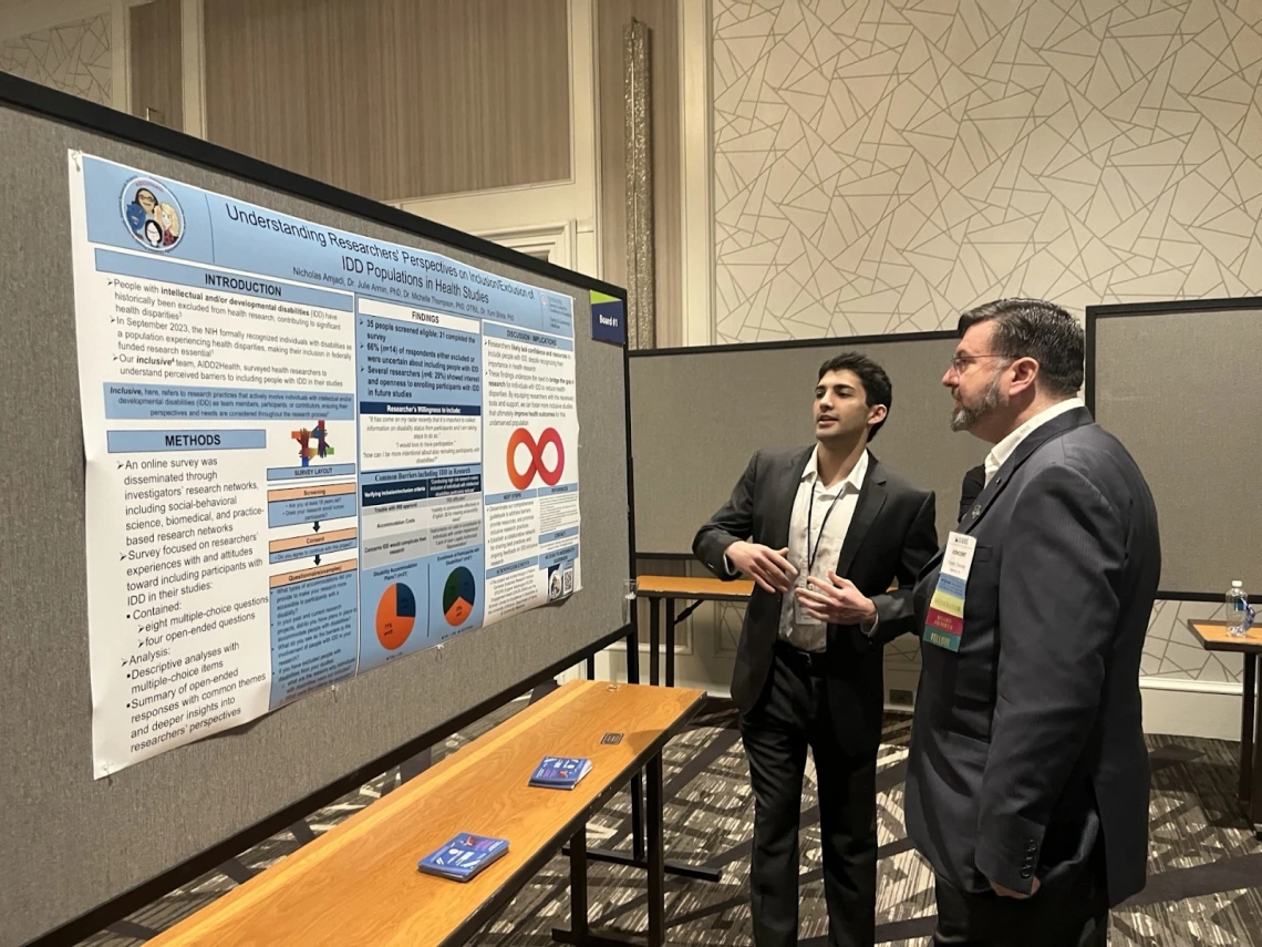 Nick Amjadi presents a poster at the AAIDD conference 