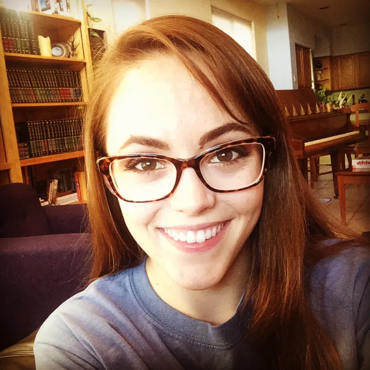 Woman in glasses smiling