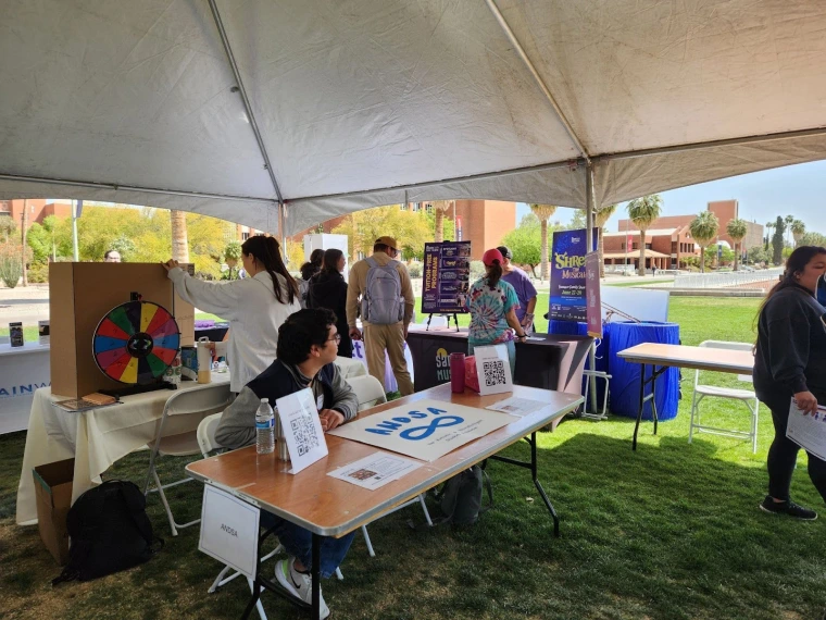 Ajai looks around from the ANDSA table.