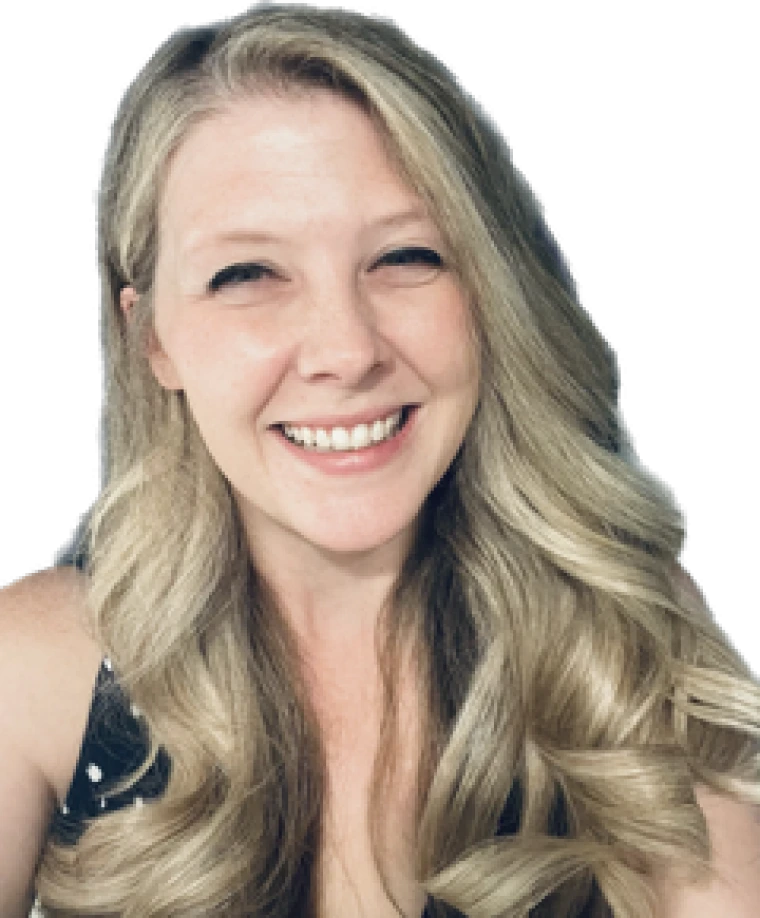 woman with long blonde hair and she is smiling at the camera