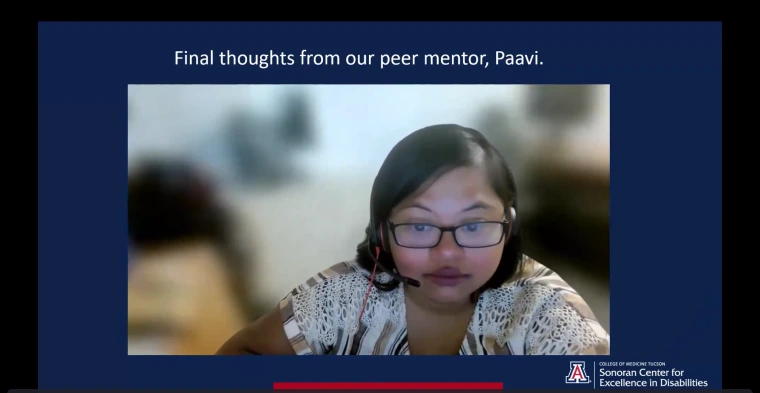 Paavi Madhivanan speaking in Gabe and Loretta’s presentation. She is seated in front of a blurred indoor background