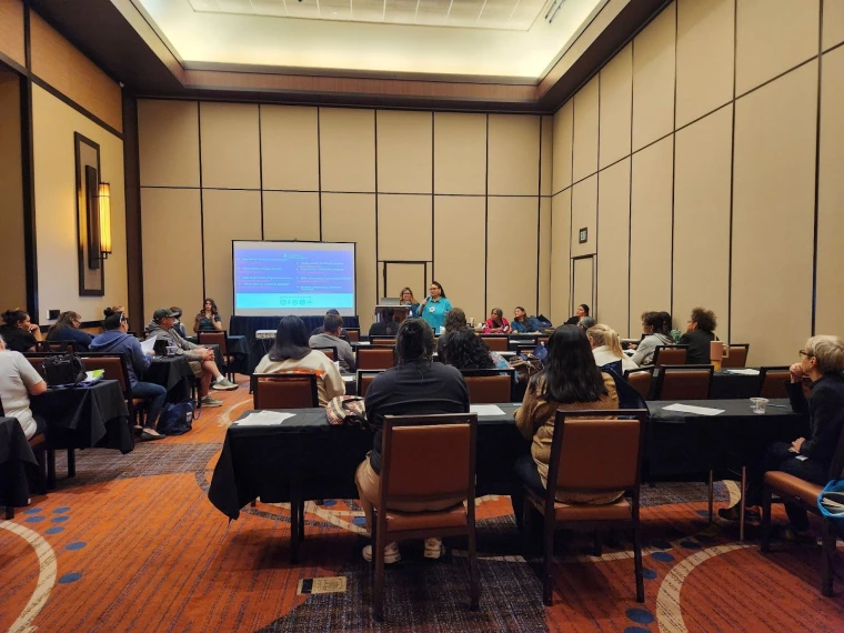 Rosa Rojas-Franco and colleagues presenting their presentation, "community leads the way"