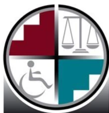 Circular logo split into four pieces. Top left piece is red and bottom right piece is blue. The top right piece has a level and the bottom left has a wheelchair image. 